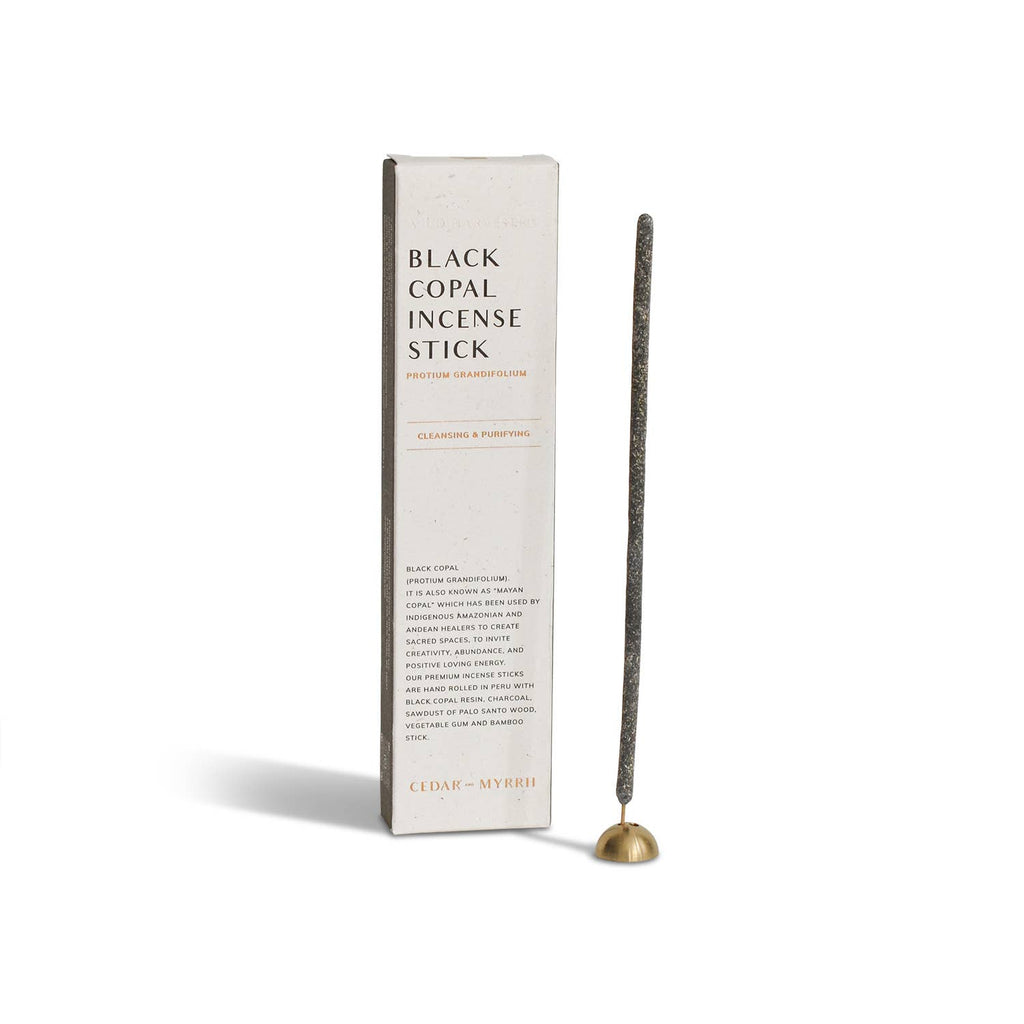 Black copal incense stick with packaging on a white background