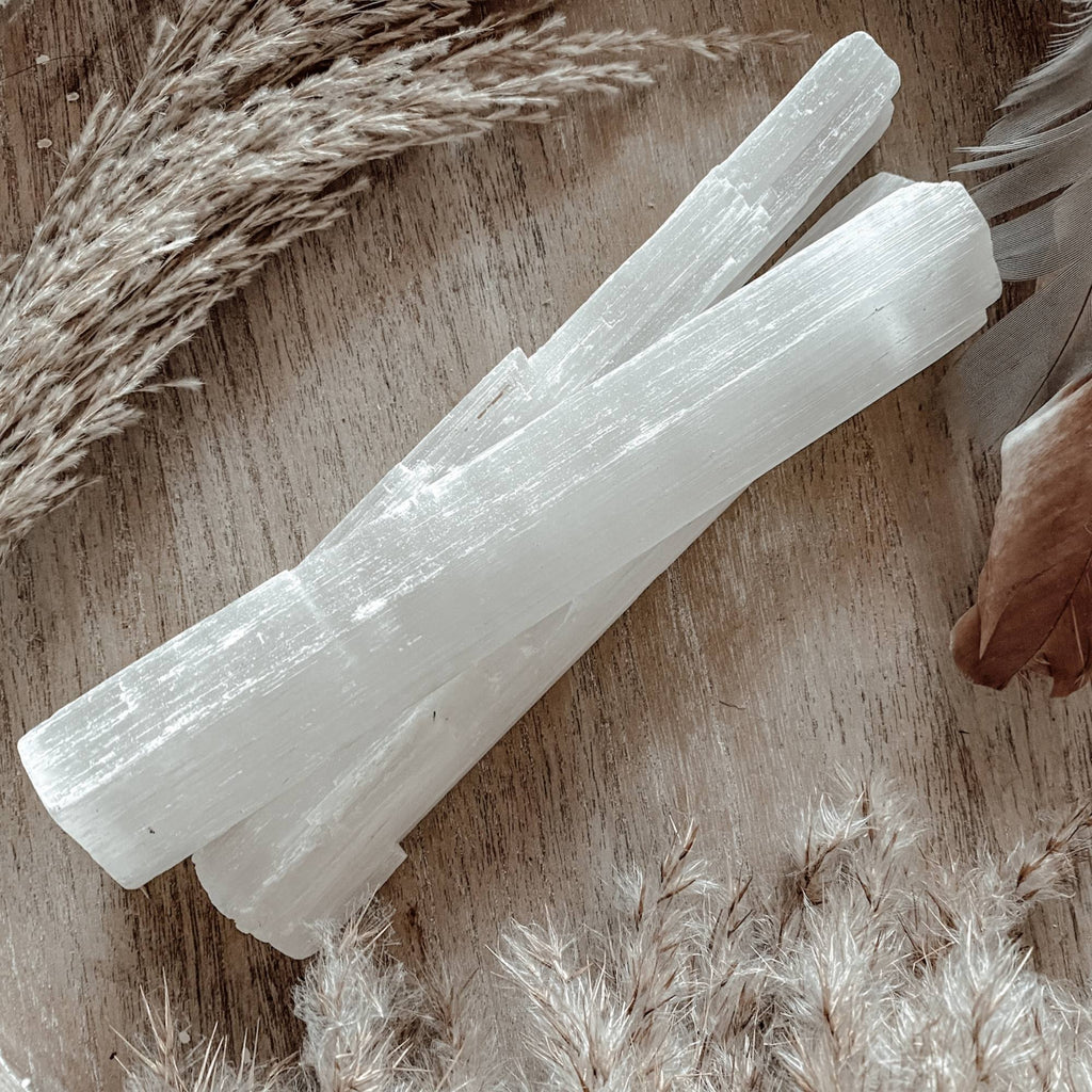 medium size selenite wand crystal available now at spiritofcacao.com.ay